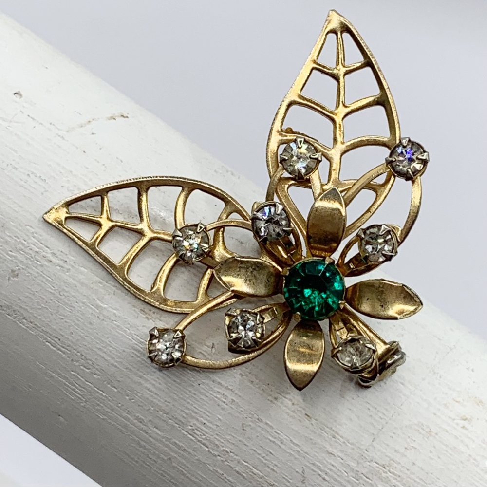 Vintage gold tone green rhinestone MCM atomic flower and leaves brooch